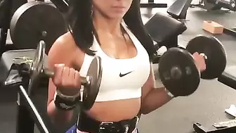 Cute Fit Girl Curling her Biceps