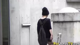 Asian babe followed and watched peeing